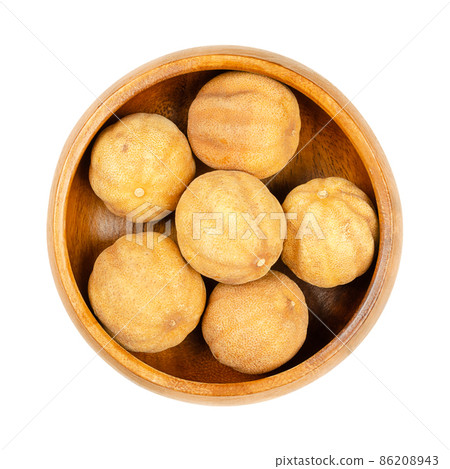 Whole, dried limes, noomi basra, in a wooden bowl. Small, brown, sun dried limes, also known as limoo amani or loomi. Traditionally used as a sour flavor in Middle Eastern dishes, or as a herbal tea. Whole, dried limes, noomi basra, in a wooden bowl. Small, brown, sun dried limes, also known as limoo amani or loomi. Traditionally used as a sour flavor in Middle Eastern dishes, or as a herbal tea. 86208943