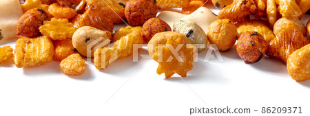 Japanese rice crackers panorama. Asian snack on a white background Japanese rice crackers panorama. Asian snack on a white background 86209371