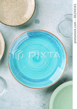 Modern tableware with a blue plate, shot from the top Modern tableware with a blue plate, shot from the top 86209381
