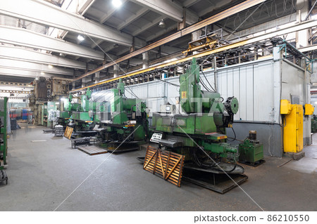 Photo of modern automatic automobile manufacturing workshop. Car production. Industrial scenery Photo of modern automatic automobile manufacturing workshop. Car production. Industrial scenery 86210550