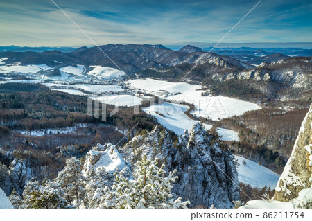 Snowy winter landscape with rocky mountain range. 86211754