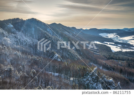 Snowy winter landscape with mountain range. Snowy winter landscape with mountain range. 86211755