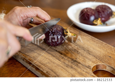 I'm about to cut and eat ripe passion fruit 86212533