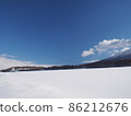 Snowfield, blue sky and silo 86212676