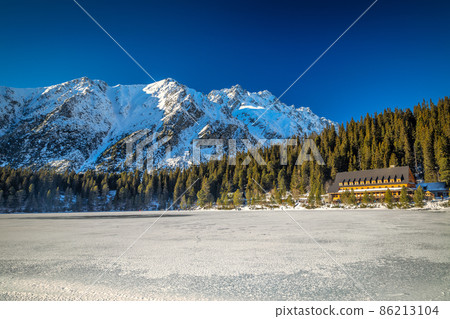 Mountain landscape with frozen tarn at winter season. Mountain landscape with frozen tarn at winter season. 86213104