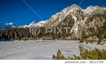 Mountain landscape with frozen tarn at winter season. Mountain landscape with frozen tarn at winter season. 86213106