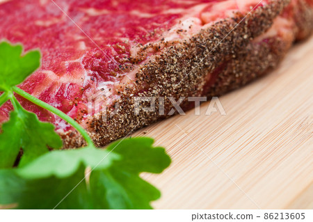 fresh marbled meat on a wooden hardboard 86213605