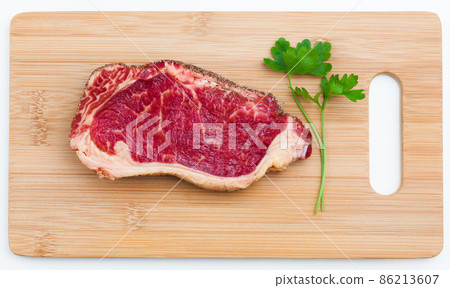 fresh marbled meat on a wooden hardboard fresh marbled meat on a wooden hardboard 86213607