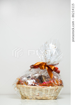 gift basket against light beige background 86214115