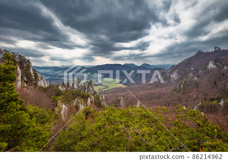 View of the mountainous landscape with rock formations in partly View of the mountainous landscape with rock formations in partly 86214962