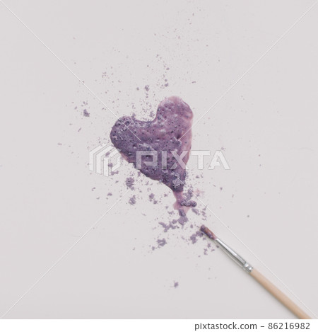 Heart symbol made of violet power on white background. Minimalist beauty branding concept. Valentine's Day composition Heart symbol made of violet power on white background. Minimalist beauty branding concept. Valentine's Day composition 86216982