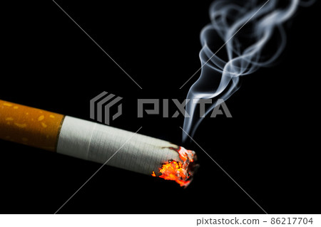 burning cigarette with smoke 86217704