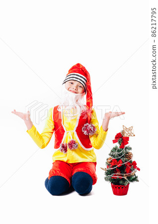 A baby dressed as a elf. isolated. Santa's helper. boy in suit of dwarf or elf 86217795