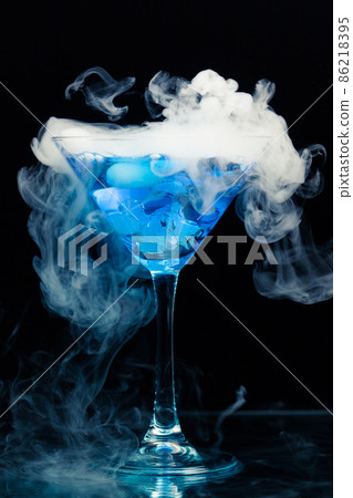 blue cocktail with splash and ice vapor 86218395