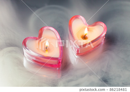 burning candle hearts in dense fog 86218481