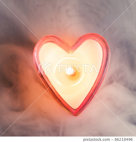 burning candle heart in dense fog 86218496