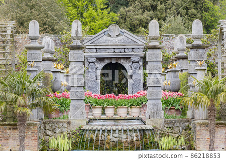 Overcast view of the garden of Arundel Castle with many flower blossom 86218853