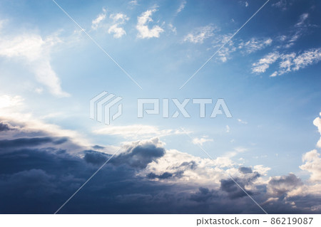 clouds on the blue sky in morning light. stormy weather approaching in summer 86219087