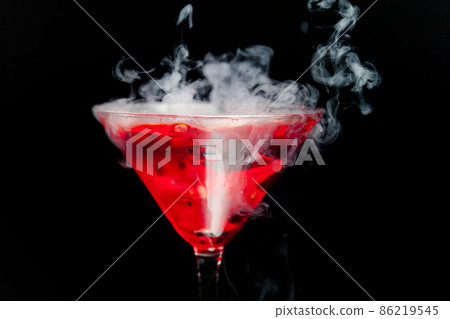 red cocktail with ice vapor 86219545