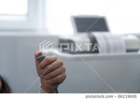 Close Up Pregnant Woman On Hospital Couch During Medical Control Cardiotocography. Visit Gynecologist Doctor At Clinic For Pregnancy Consultant. Examine Expectant Belly Baby Mother Healthcare Check Up 86219698