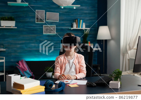 Little schoolkid with virtual reality headset enjoying playing with vr glasses 86219877