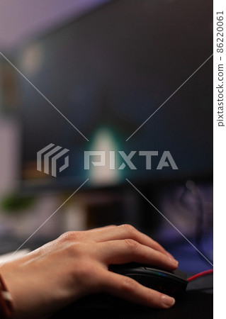 Close up of woman using mousepad to play video games 86220061