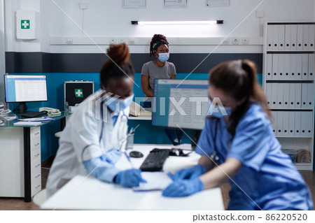 Medical team with protective face mask to prevent infection with covid19 86220520