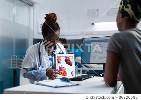 African american specialist cardiologist explaining heart radiography expertise 86220588