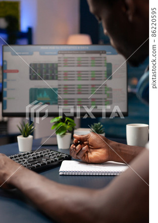 Close up of entrepreneur analyzing numbers of stock market trade 86220595