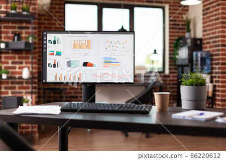 Nobody in office with business data charts on monitor Nobody in office with business data charts on monitor 86220612