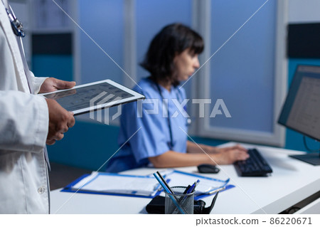 Doctor holding modern tablet for osteopathy diagnosis Doctor holding modern tablet for osteopathy diagnosis 86220671