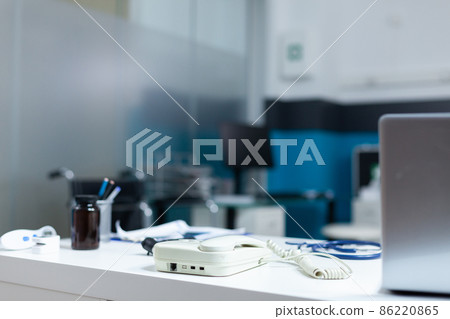 Modern empty doctor office equipped with professional medical instruments Modern empty doctor office equipped with professional medical instruments 86220865