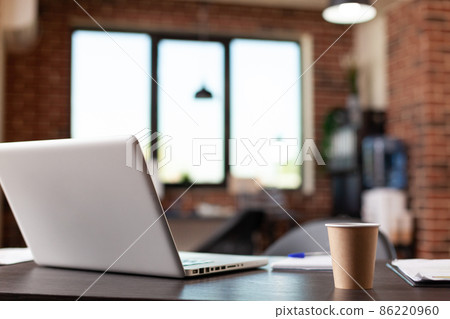 Close up of laptop computer and coffee cup on desk 86220960
