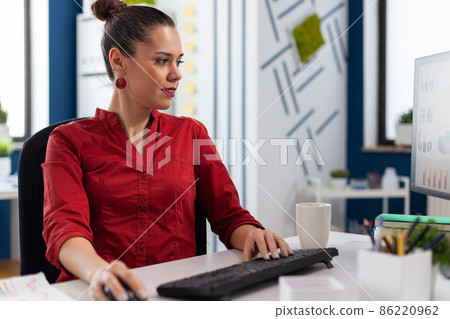 Content businesswoman reading chart on computer screen. Content businesswoman reading chart on computer screen. 86220962