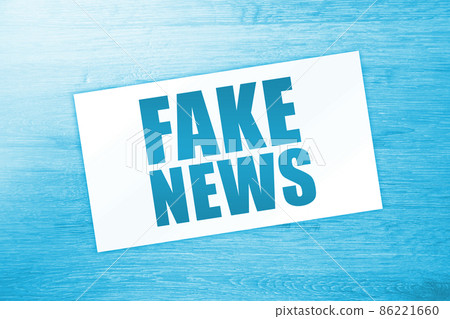 Fake News words on card on wooden table. Business news concept Fake News words on card on wooden table. Business news concept 86221660