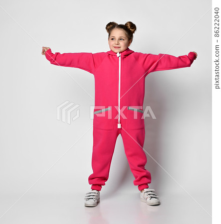 Playful cheerful baby girl in a stylish modern 86222040
