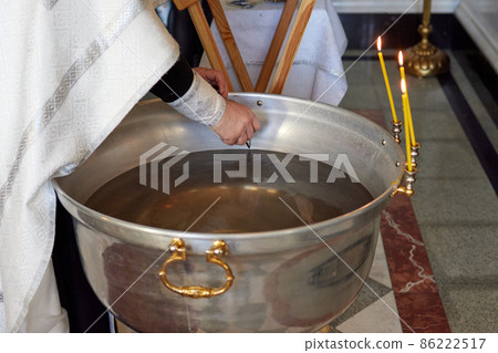 baby christening. Ceremony of a christening in Christian church. baptismal. 86222517