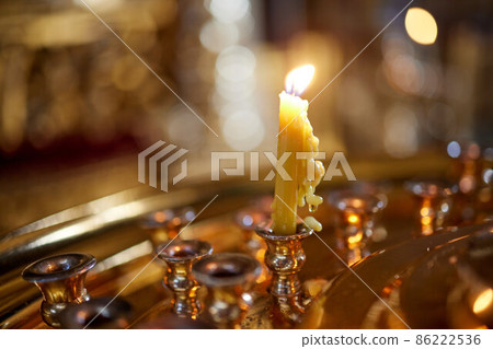 burning church candles near the altar. Close-up. burning church candles near the altar. Close-up. 86222536