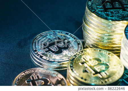 Horizontal view of cryptocurrency tokens, including Bitcoin, dogecoin, and ethererum seen from above on a black background Horizontal view of cryptocurrency tokens, including Bitcoin, dogecoin, and ethererum seen from above on a black background 86222646