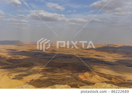Ramon Crater Makhtesh Ramon, the largest in the world, as seen from the high rocky cliff edge surrounding it from the north, Ramon Nature reserve, Mitzpe Ramon, Negev desert, Israel Ramon Crater Makhtesh Ramon, the largest in the world, as seen from the high rocky cliff edge surrounding it from the north, Ramon Nature reserve, Mitzpe Ramon, Negev desert, Israel 86222689