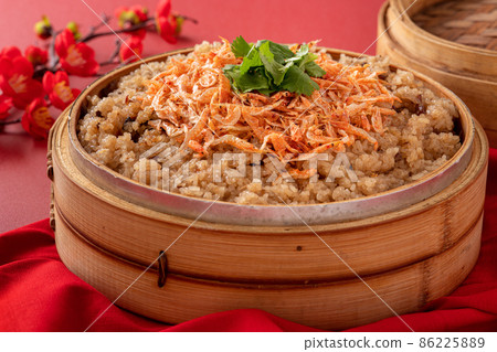 Delicious Chinese glutinous sticky oil rice cake named migao for lunar new year's dishes. 86225889