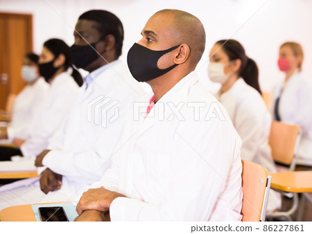 Man listening to lecture at medical conference 86227861