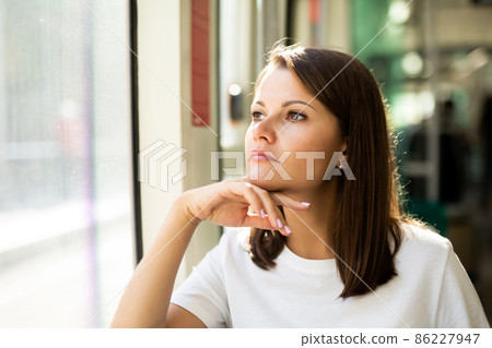 Female passenger in public land transport 86227947