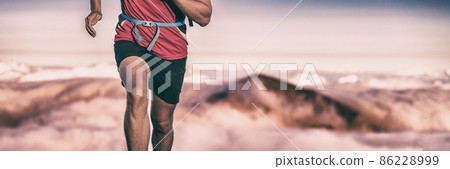 Trail run runner man athlete training on difficult path climbing up mountain top reaching summit. Endurance sport active lifesytle banner panorama Trail run runner man athlete training on difficult path climbing up mountain top reaching summit. Endurance sport active lifesytle banner panorama 86228999
