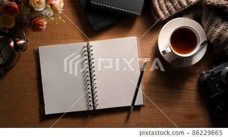 Vintage workspace concept with empty notebook page mockup Vintage workspace concept with empty notebook page mockup 86229665