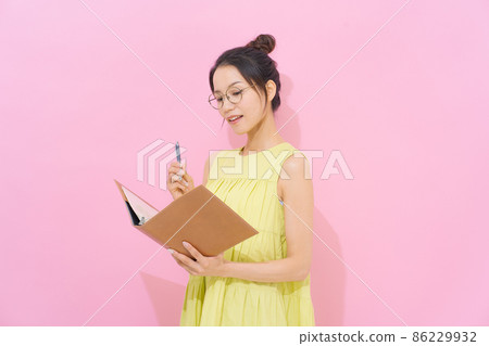 Female in her 20s pink background 86229932