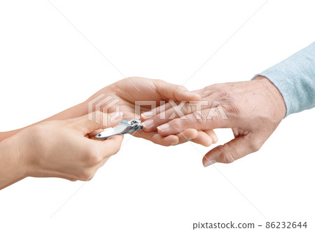 Daughter hands help cutting nails with nail clipper for mother 86232644