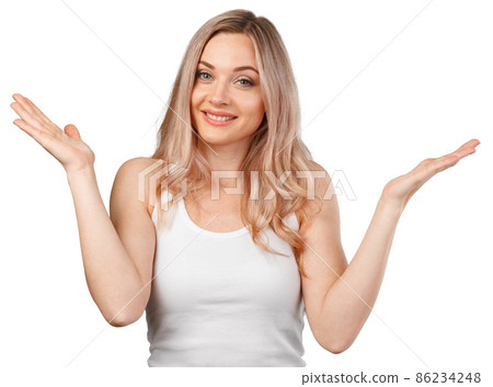 Portrait of uncertain young woman with blonde hair standing with raised arms isolated on white 86234248