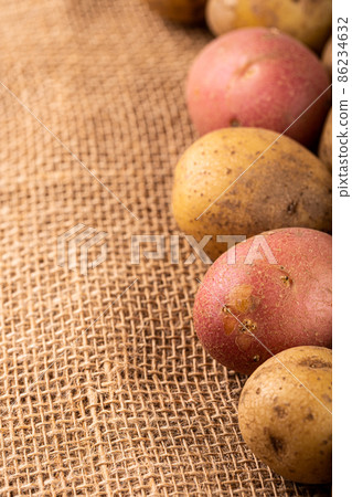 Raw whole washed organic potatoes Raw whole washed organic potatoes 86234632