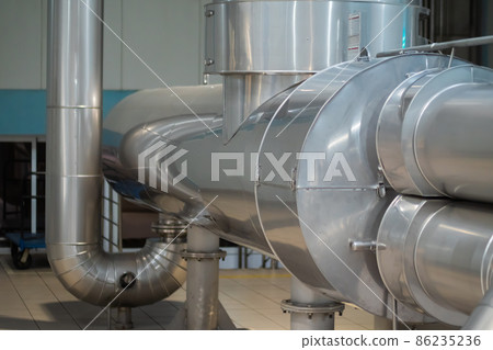 Steel pipes at beer factory - brewery equipment Steel pipes at beer factory - brewery equipment 86235236